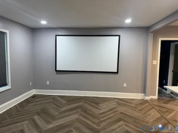 a view of room with wooden floor