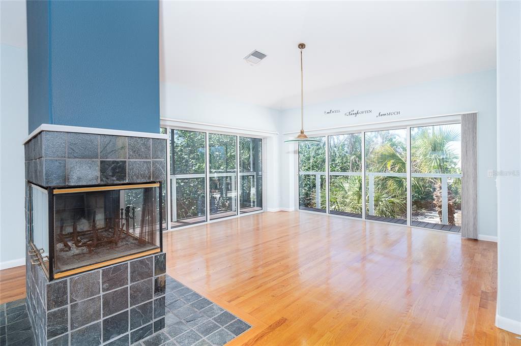 5 Pointe Way Placida, FL 33946 - Photo 11 of 69 a view of an empty room with wooden floor and a window