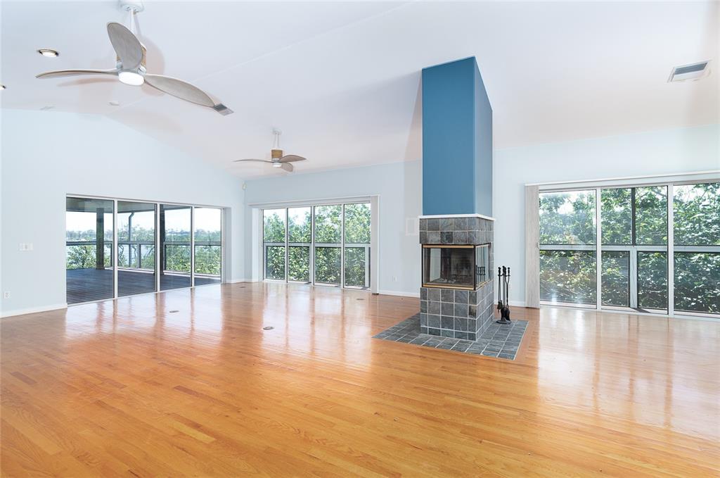 5 Pointe Way Placida, FL 33946 - Photo 12 of 69 a view of empty room with wooden floor and fan