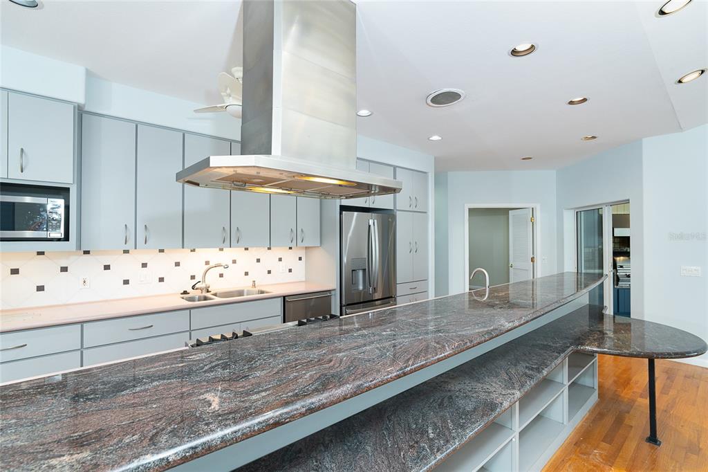 5 Pointe Way Placida, FL 33946 - Photo 15 of 69 a kitchen with stainless steel appliances kitchen island granite countertop a sink and cabinets