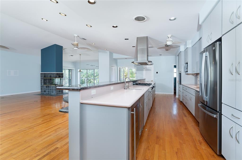 5 Pointe Way Placida, FL 33946 - Photo 18 of 69 a kitchen with stainless steel appliances kitchen island a large counter top space and wooden floor