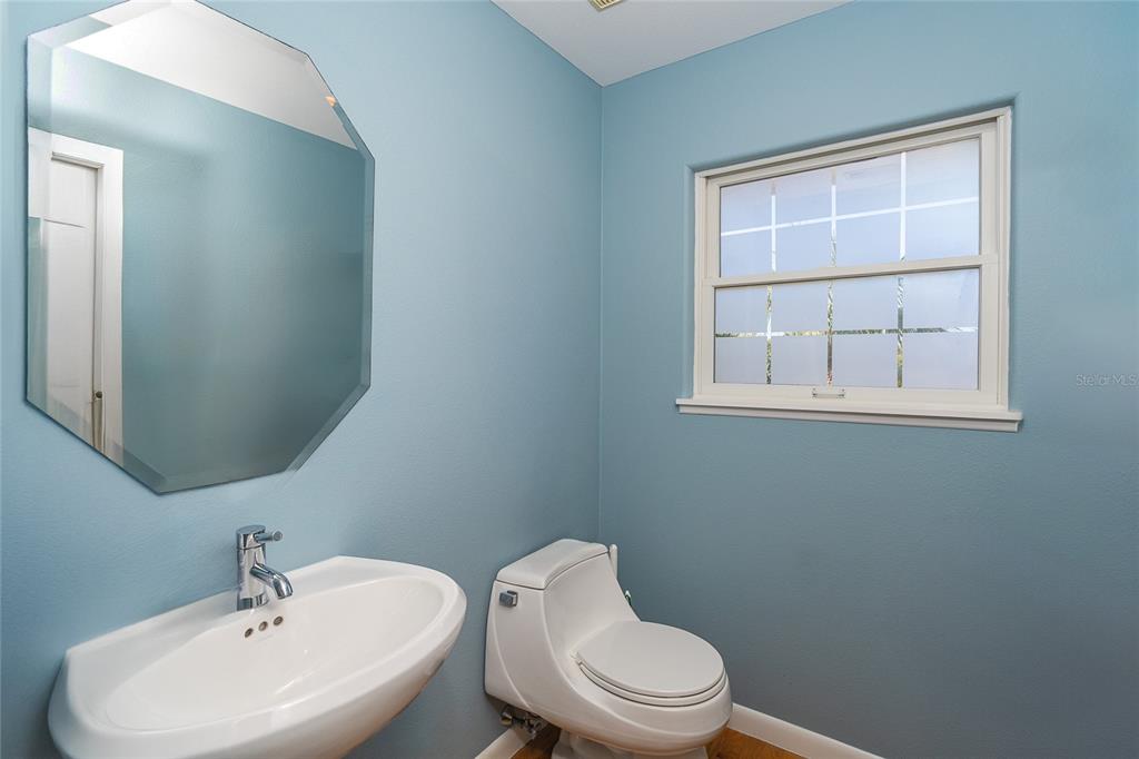 5 Pointe Way Placida, FL 33946 - Photo 19 of 69 a white toilet sitting next to a bathroom sink