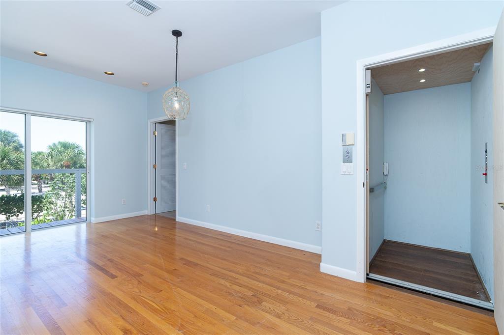 5 Pointe Way Placida, FL 33946 - Photo 25 of 69 a view of an empty room with wooden floor and a window