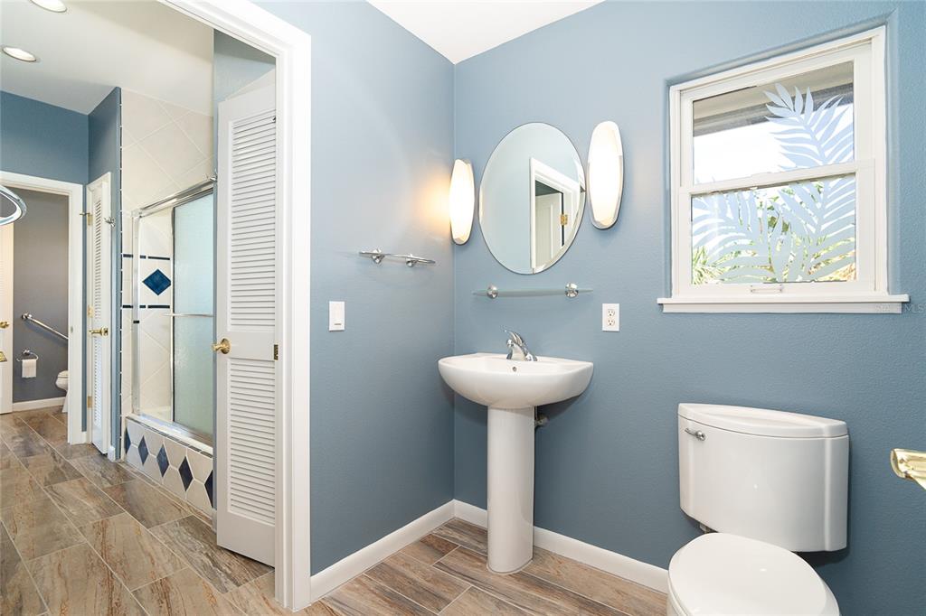 5 Pointe Way Placida, FL 33946 - Photo 31 of 69 a bathroom with a toilet sink and mirror