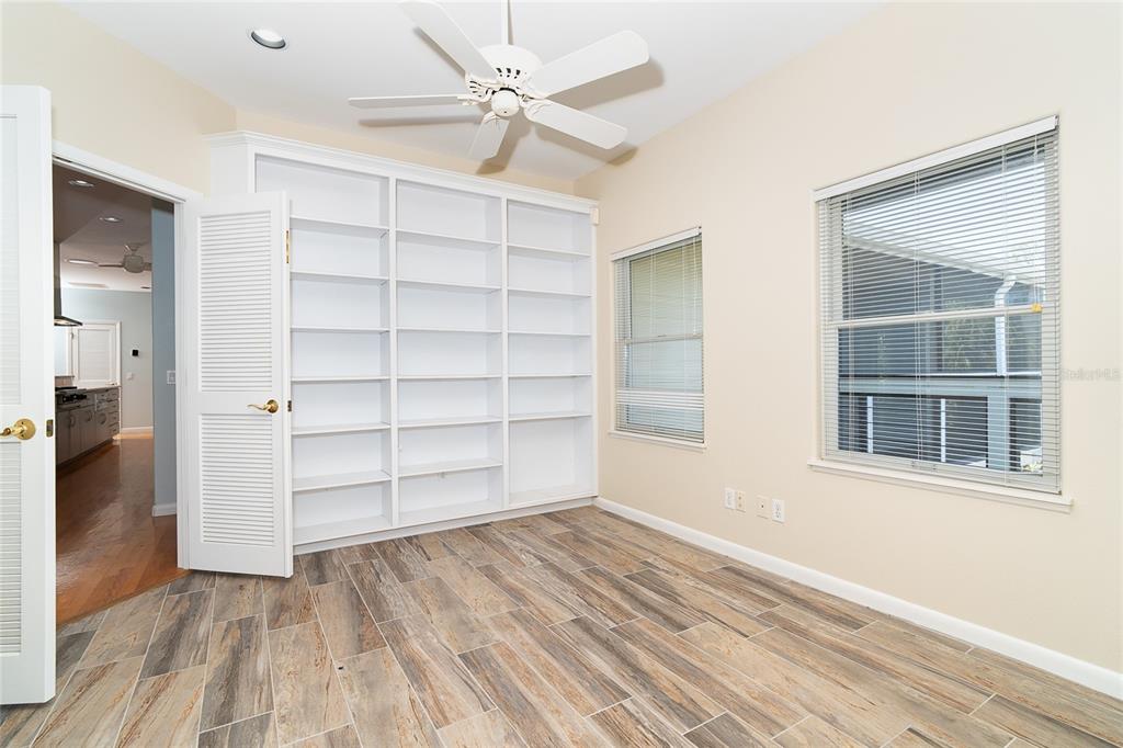 5 Pointe Way Placida, FL 33946 - Photo 33 of 69 a view of an empty room with a window and wooden floor