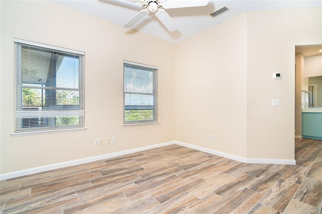 5 Pointe Way Placida, FL 33946 - Photo 35 of 69 a view of empty room with wooden floor and fan
