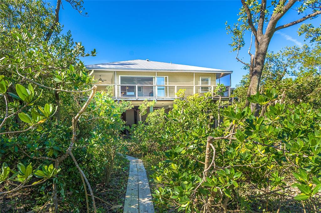 5 Pointe Way Placida, FL 33946 - Photo 45 of 69 a front view of a house with a yard