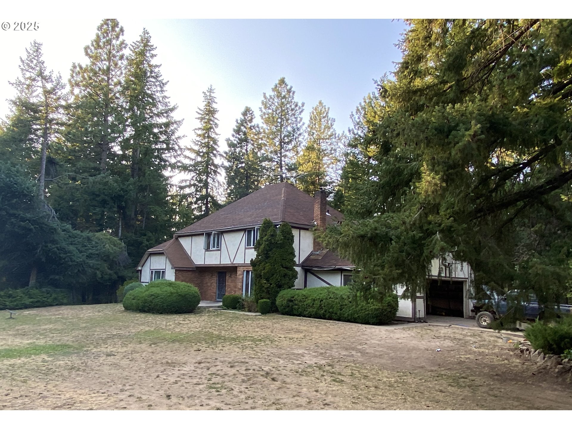 325 Pothole Road Goldendale, WA 98620 - Photo 2 of 2 a front view of a house with a yard and tree s