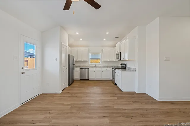 a view of kitchen with wooden floor
