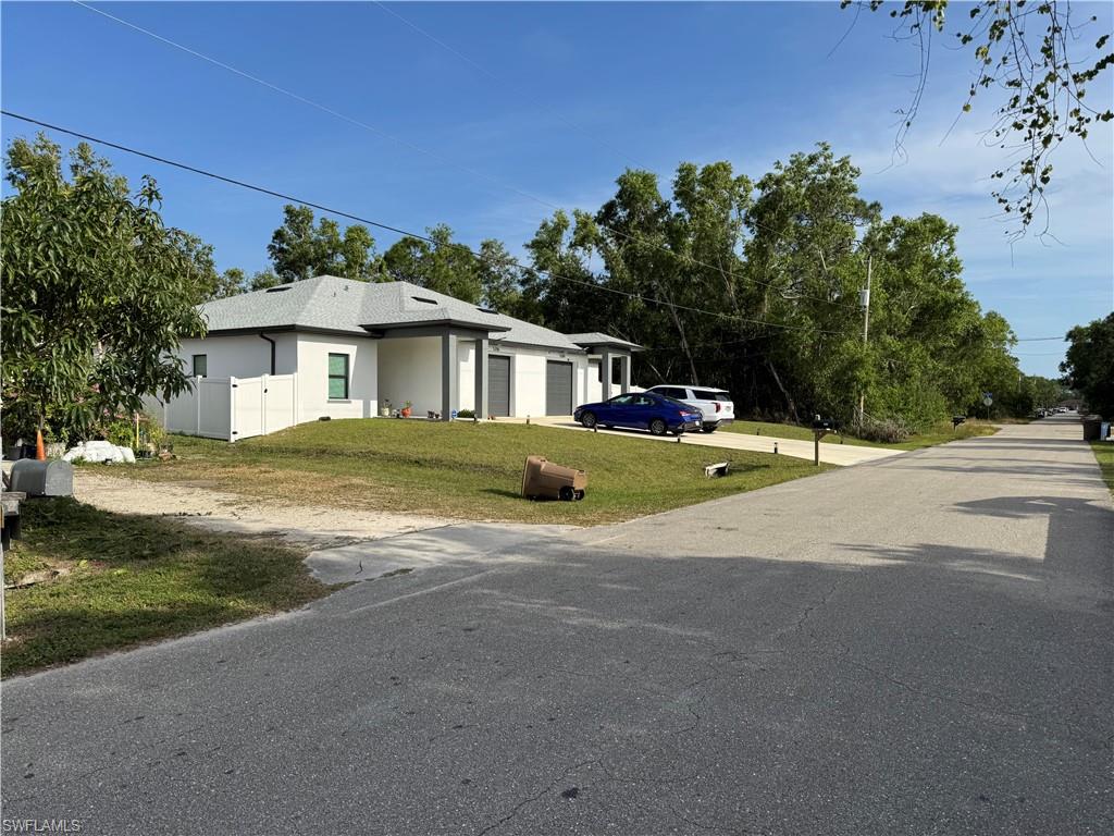 5211 29th Street Southwest Lehigh Acres, FL 33973 - Photo 5 of 5 a view of a house with a swimming pool