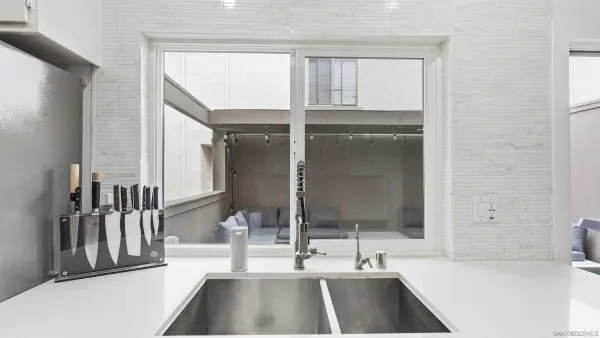 a bathroom with a sink and a large mirror