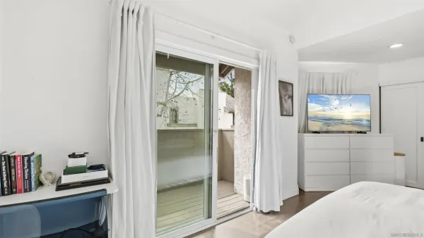 a bedroom with a bed and a bookshelf