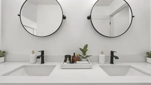 a bathroom with a mirror and a sink