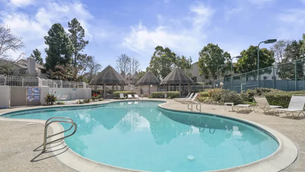 a view of a swimming pool with sitting area
