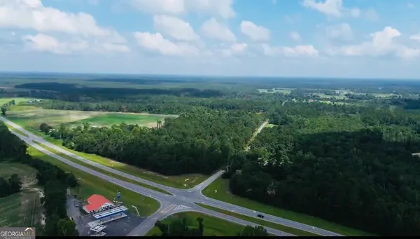 a view of a back yard from a balcony