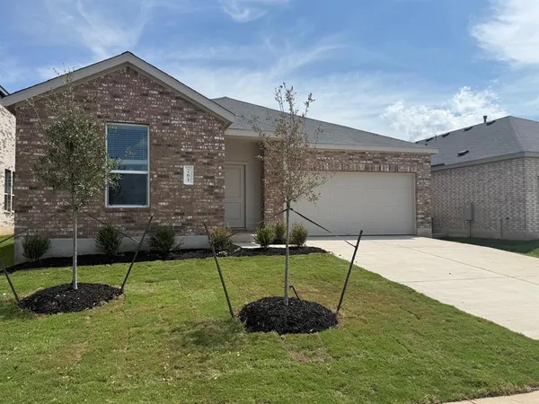 a house view with a garden space