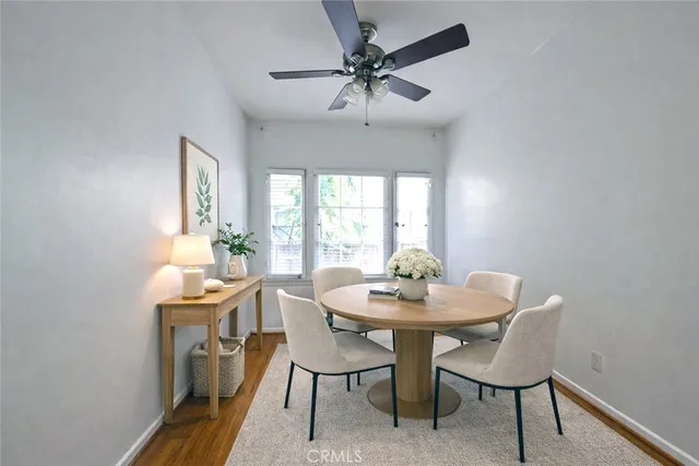 a view of a dining room with furniture and window