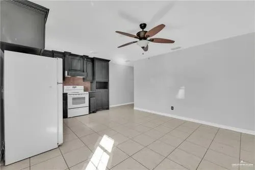 a view of a kitchen with a sink and dishwasher