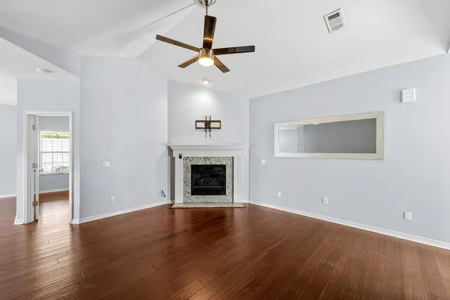a view of a kitchen with a sink and refrigerator