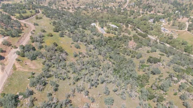 a view of a mountain in the distance in a field