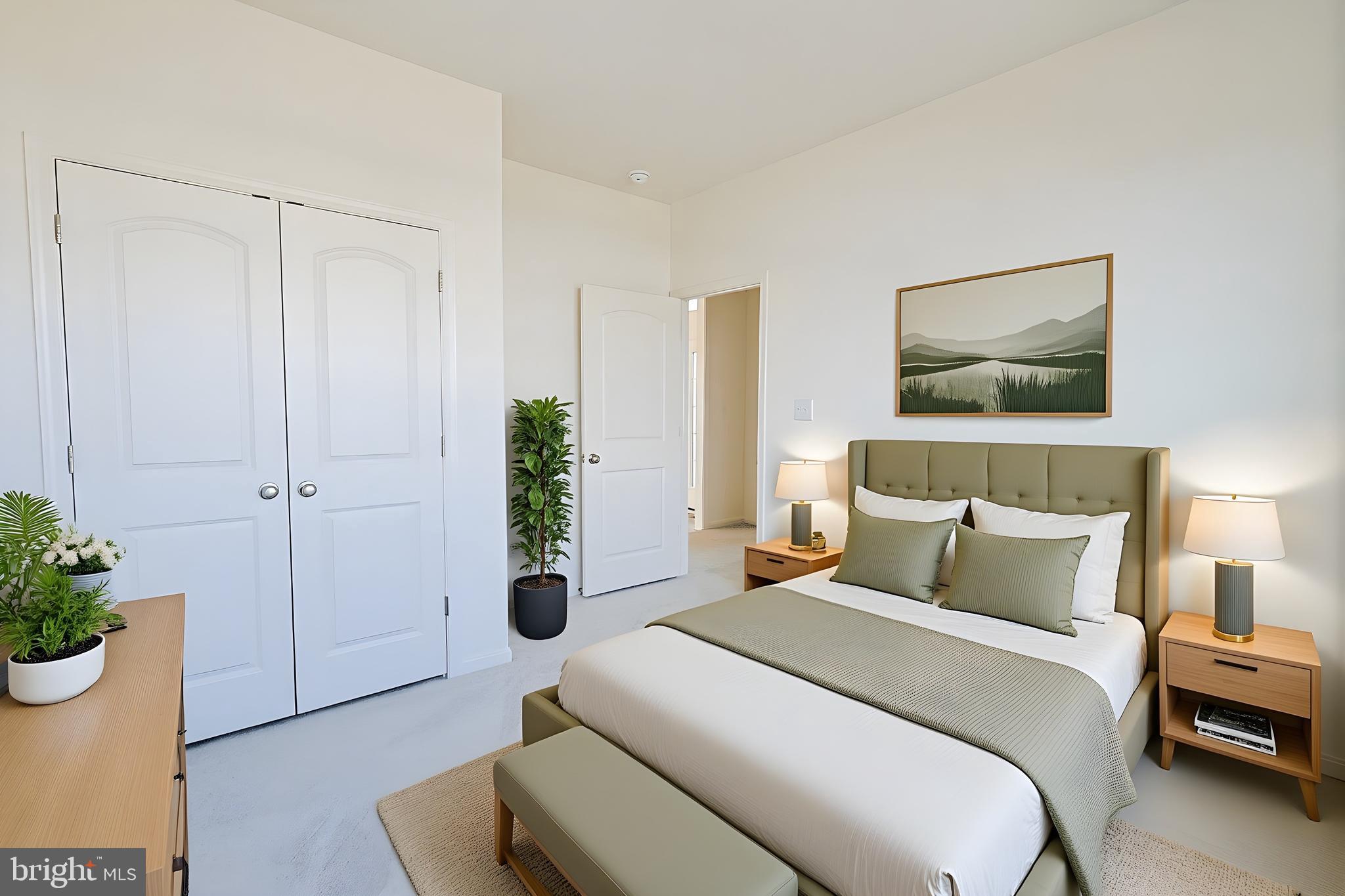 910 Weatherstone Lane Felton, DE 19943 - Photo 26 of 29 a bedroom with a bed and a potted plant