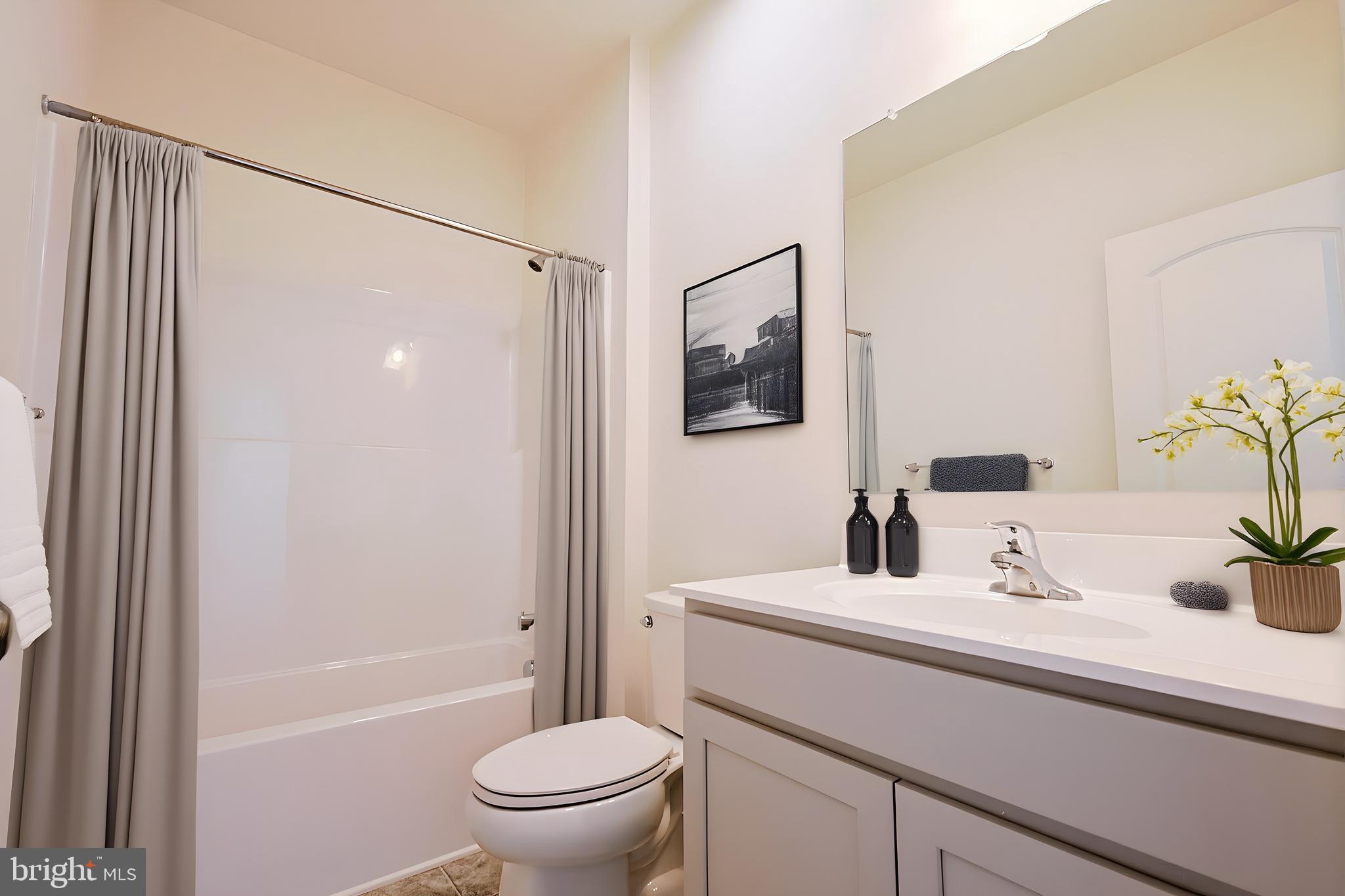 910 Weatherstone Lane Felton, DE 19943 - Photo 27 of 29 a bathroom with a sink toilet and shower