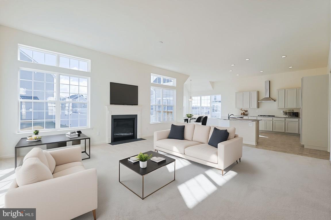 910 Weatherstone Lane Felton, DE 19943 - Photo 6 of 29 a living room with furniture and a fireplace