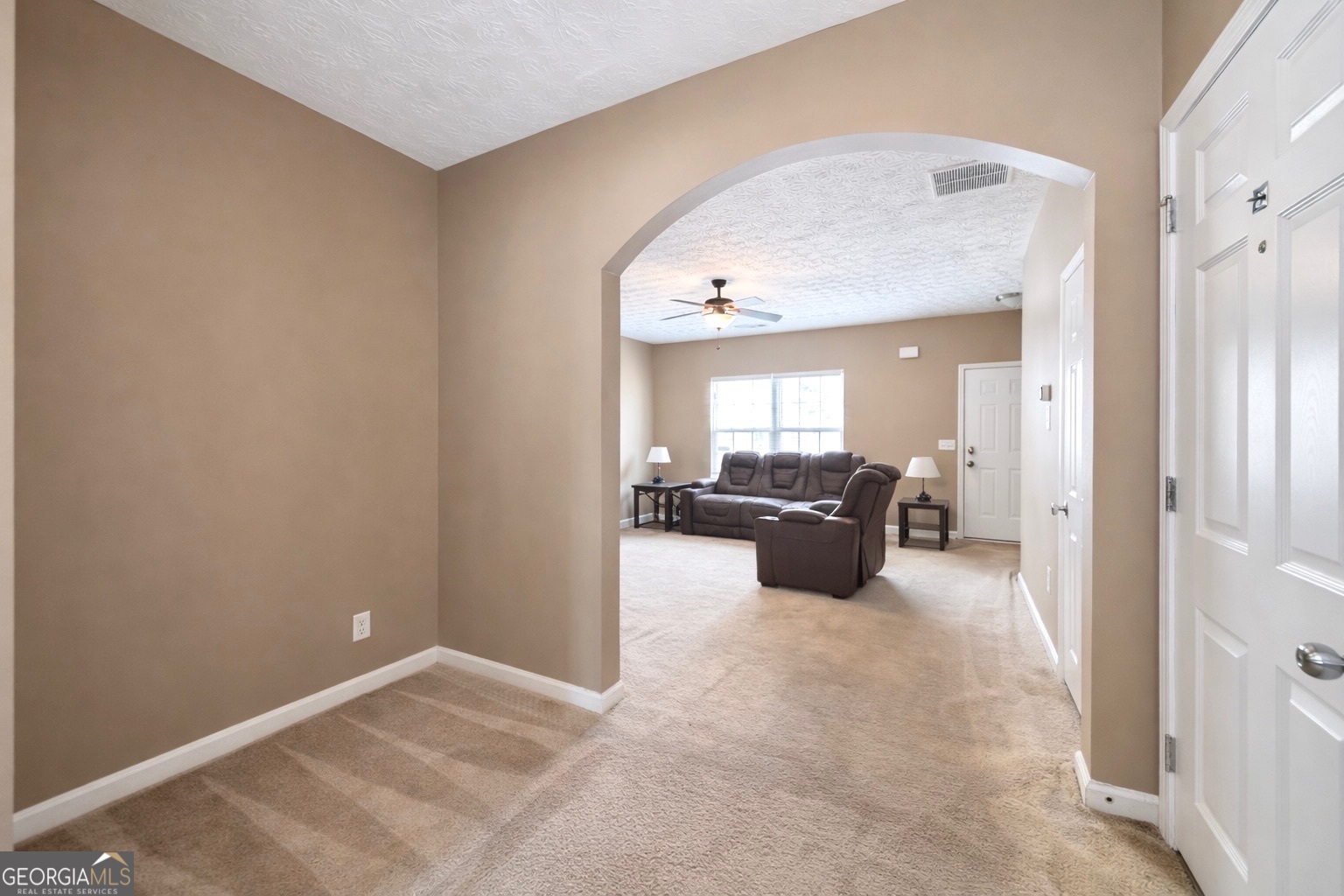 6198 Shoals Loop Union City, GA 30291 - Photo 11 of 21 a large room with a large mirror and furniture