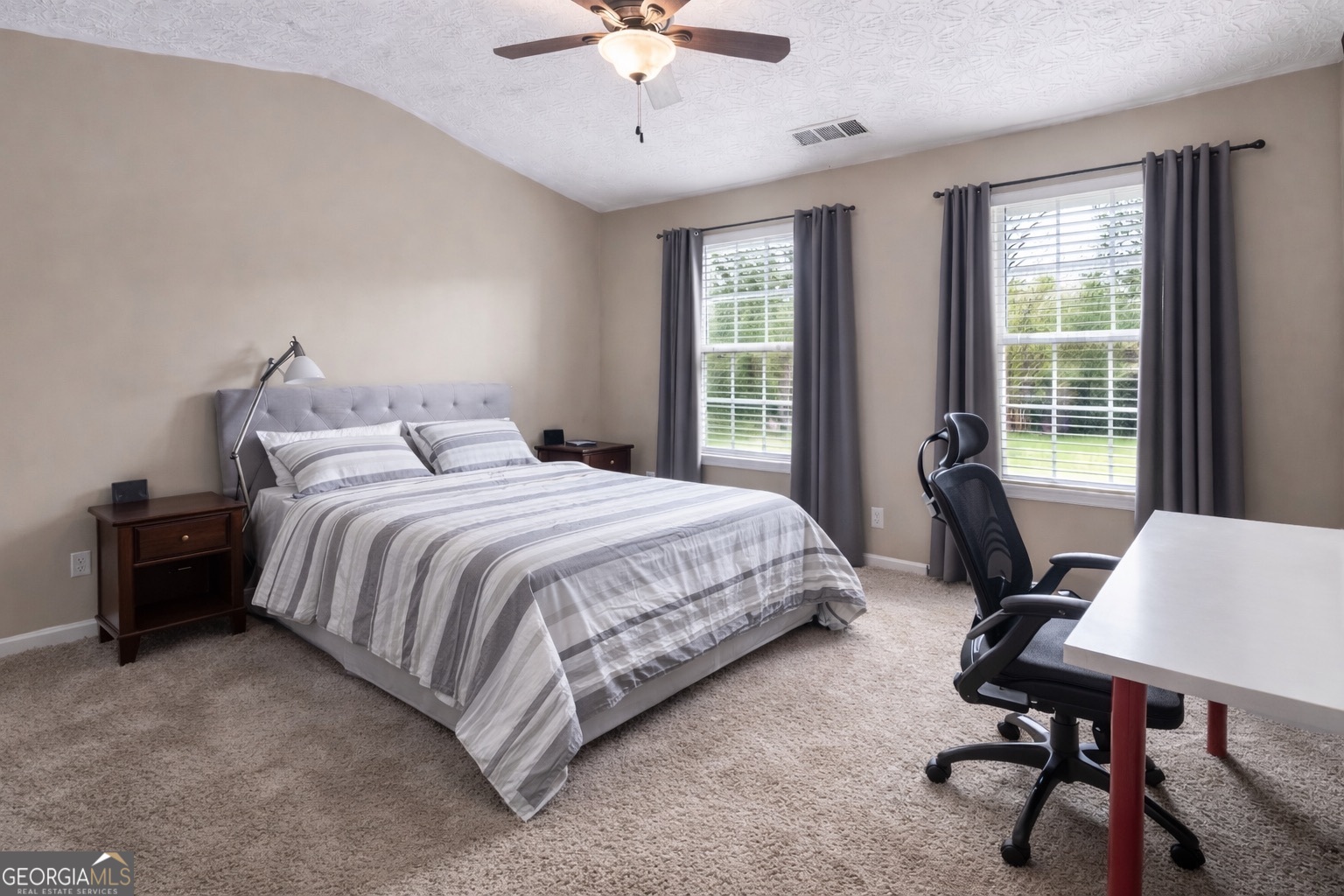 6198 Shoals Loop Union City, GA 30291 - Photo 13 of 21 a spacious bedroom with a bed and a desk