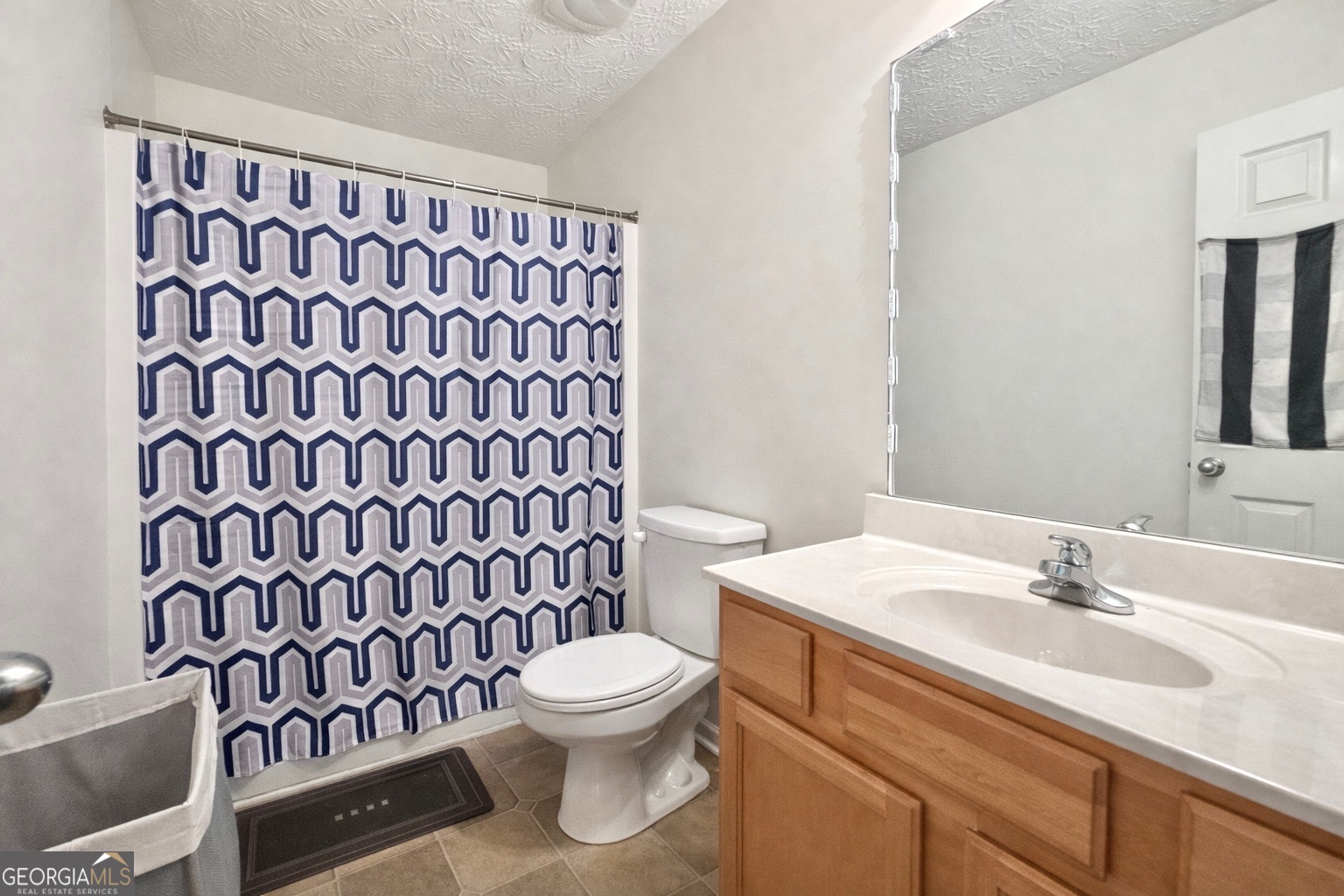 6198 Shoals Loop Union City, GA 30291 - Photo 20 of 21 a bathroom with a sink and a mirror