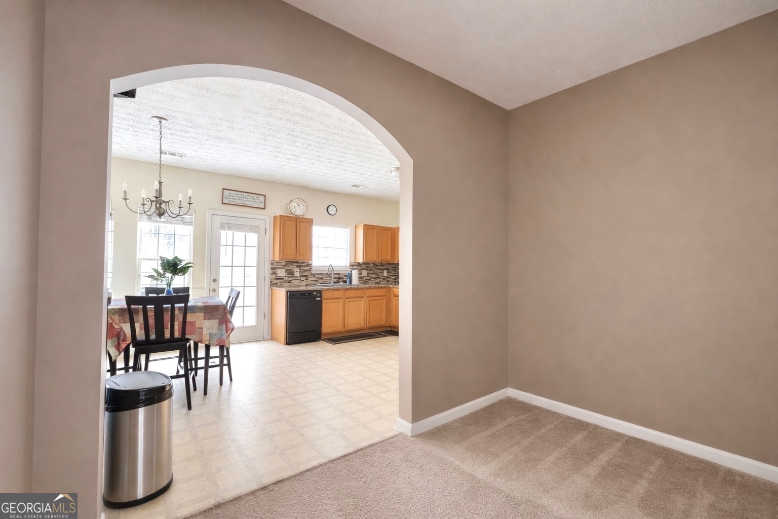 6198 Shoals Loop Union City, GA 30291 - Photo 6 of 21 a view of kitchen with dining area and chandelier