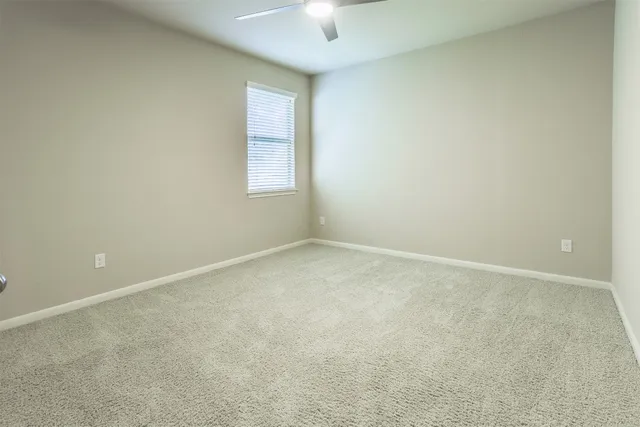 an empty room with a empty space and a window