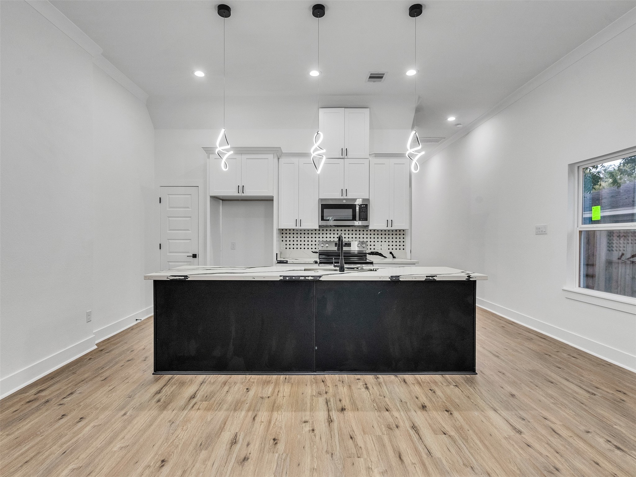 7358 Guadalcanal Road, Unit A Houston, TX 77033 - Photo 9 of 35 a view of kitchen with granite countertop window