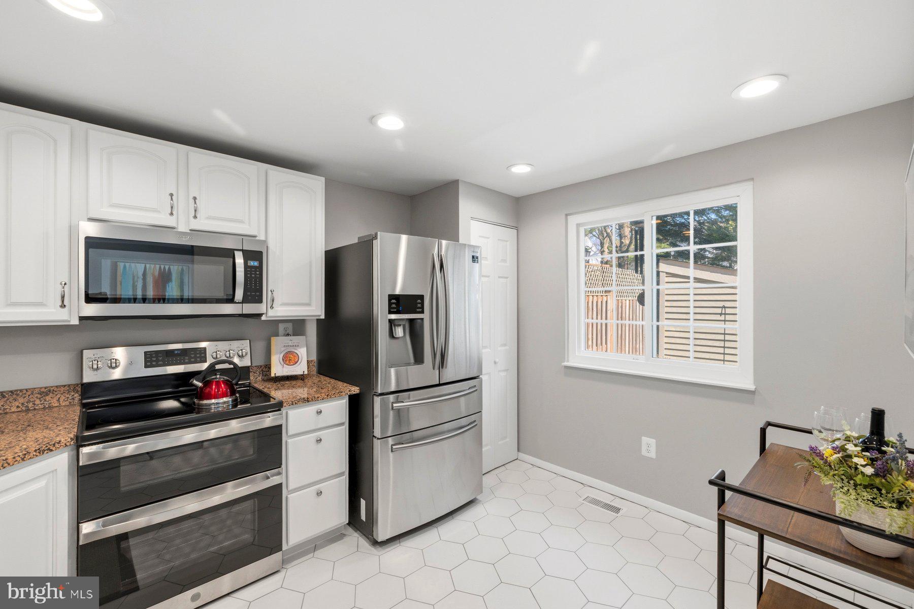 5 Pontiac Way Gaithersburg, MD 20878 - Photo 11 of 40 a kitchen with stainless steel appliances a refrigerator stove and microwave