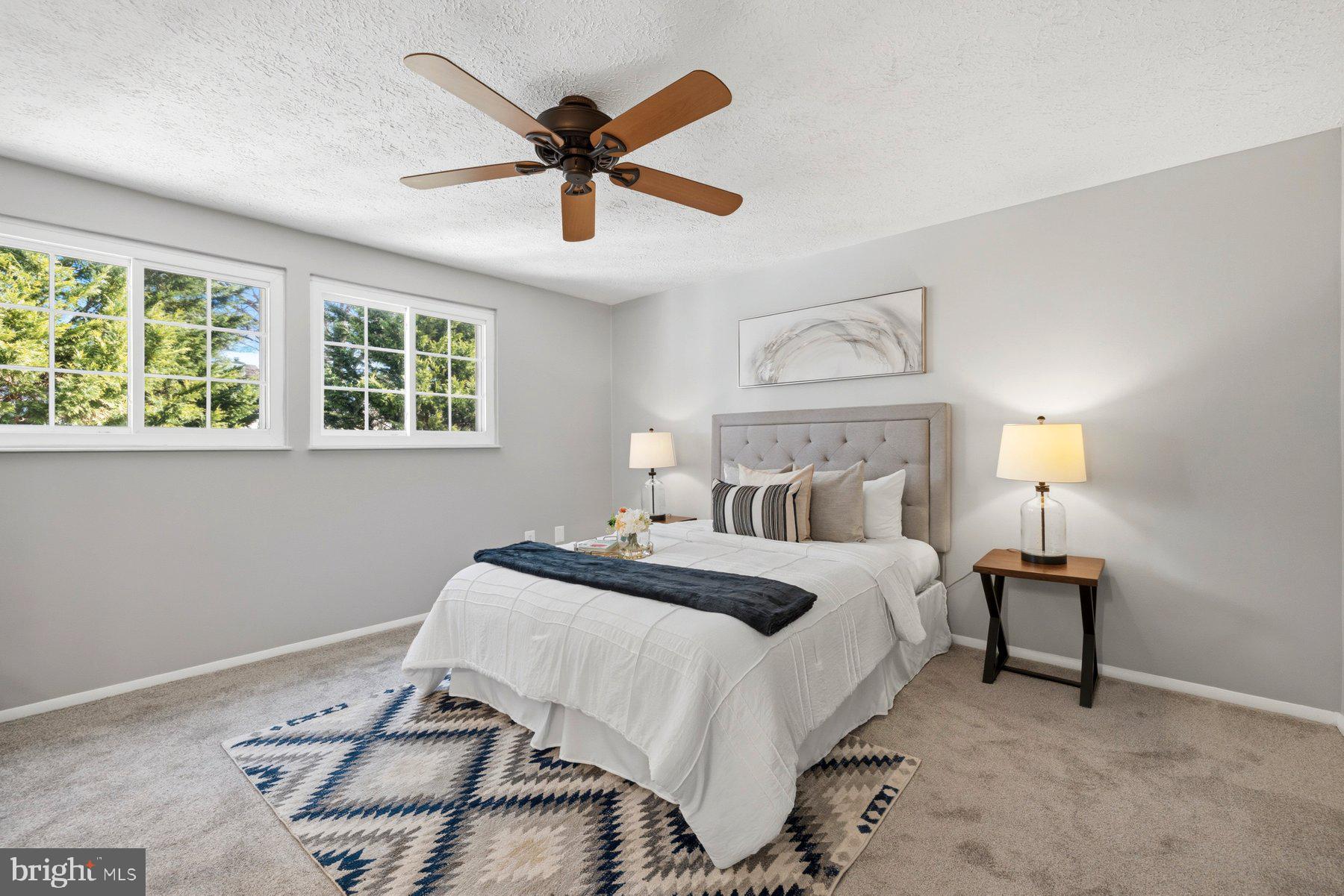 5 Pontiac Way Gaithersburg, MD 20878 - Photo 15 of 40 a bedroom with a bed and a chandelier