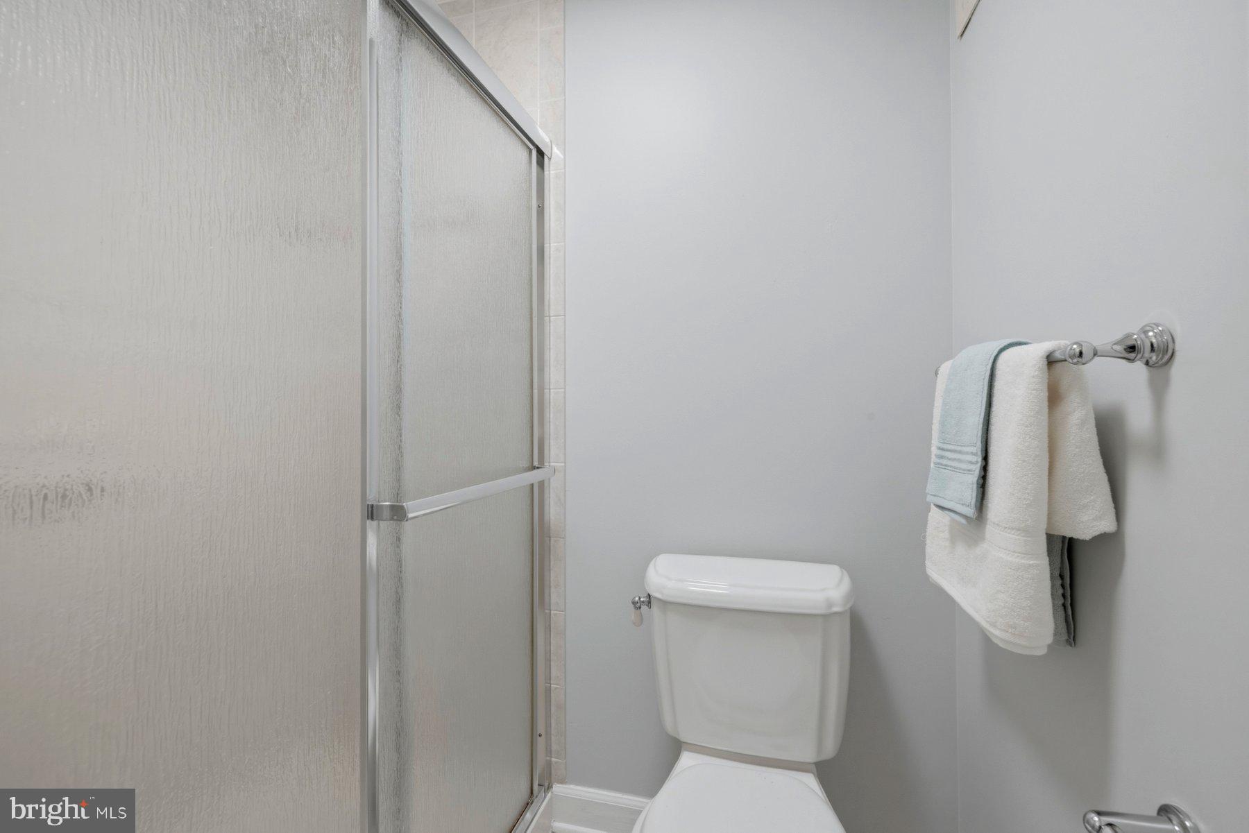 5 Pontiac Way Gaithersburg, MD 20878 - Photo 19 of 40 a white toilet sitting next to a shower