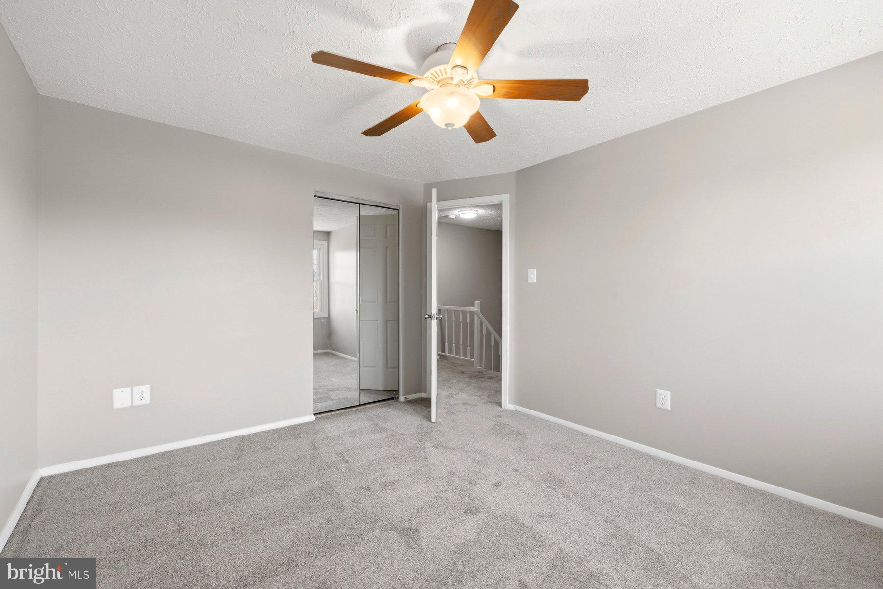 5 Pontiac Way Gaithersburg, MD 20878 - Photo 22 of 40 an empty room with closet and a chandelier fan
