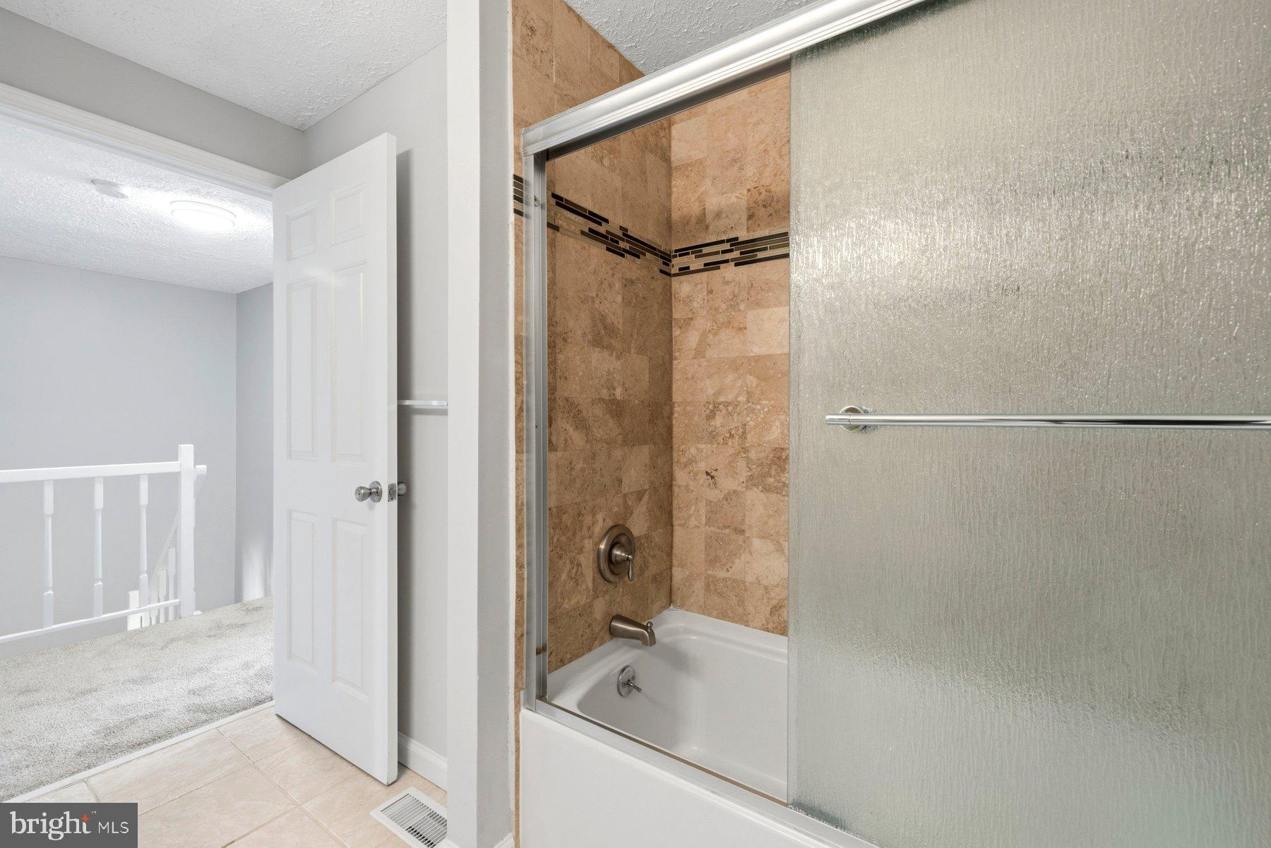 5 Pontiac Way Gaithersburg, MD 20878 - Photo 23 of 40 a bathroom with a bathtub and a shower