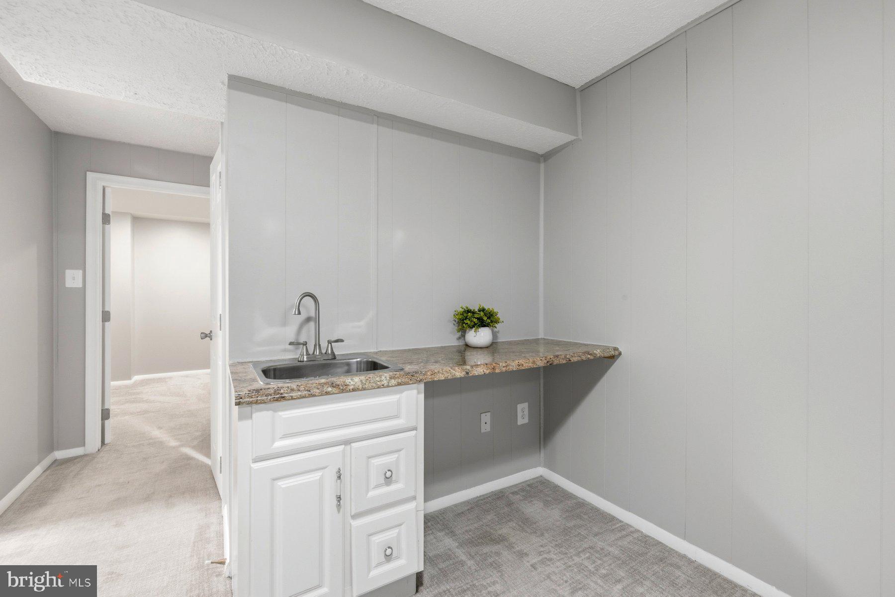 5 Pontiac Way Gaithersburg, MD 20878 - Photo 30 of 40 a bathroom with a granite countertop sink and a mirror