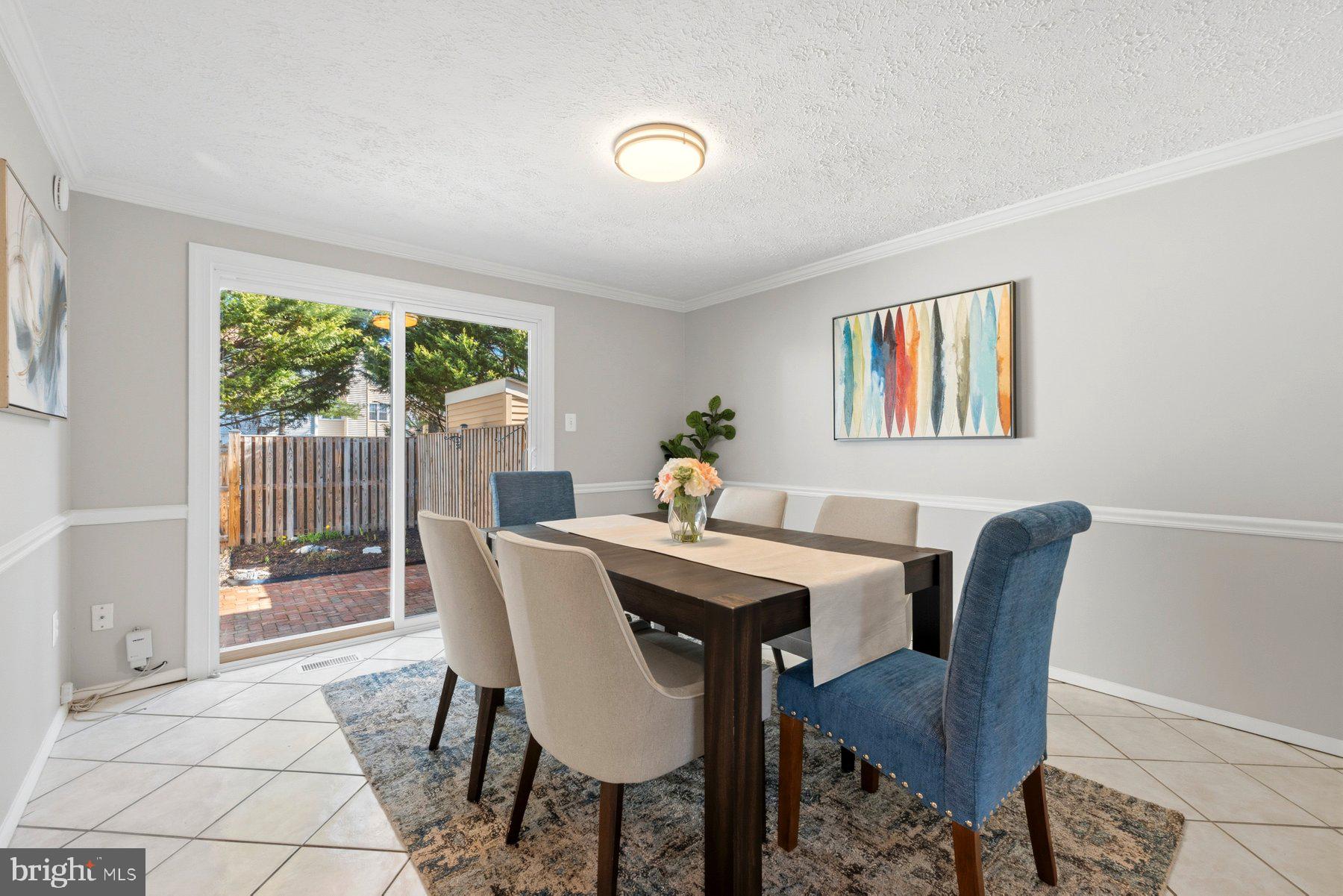 5 Pontiac Way Gaithersburg, MD 20878 - Photo 8 of 40 a view of a dining room with furniture wooden floor and a potted plant