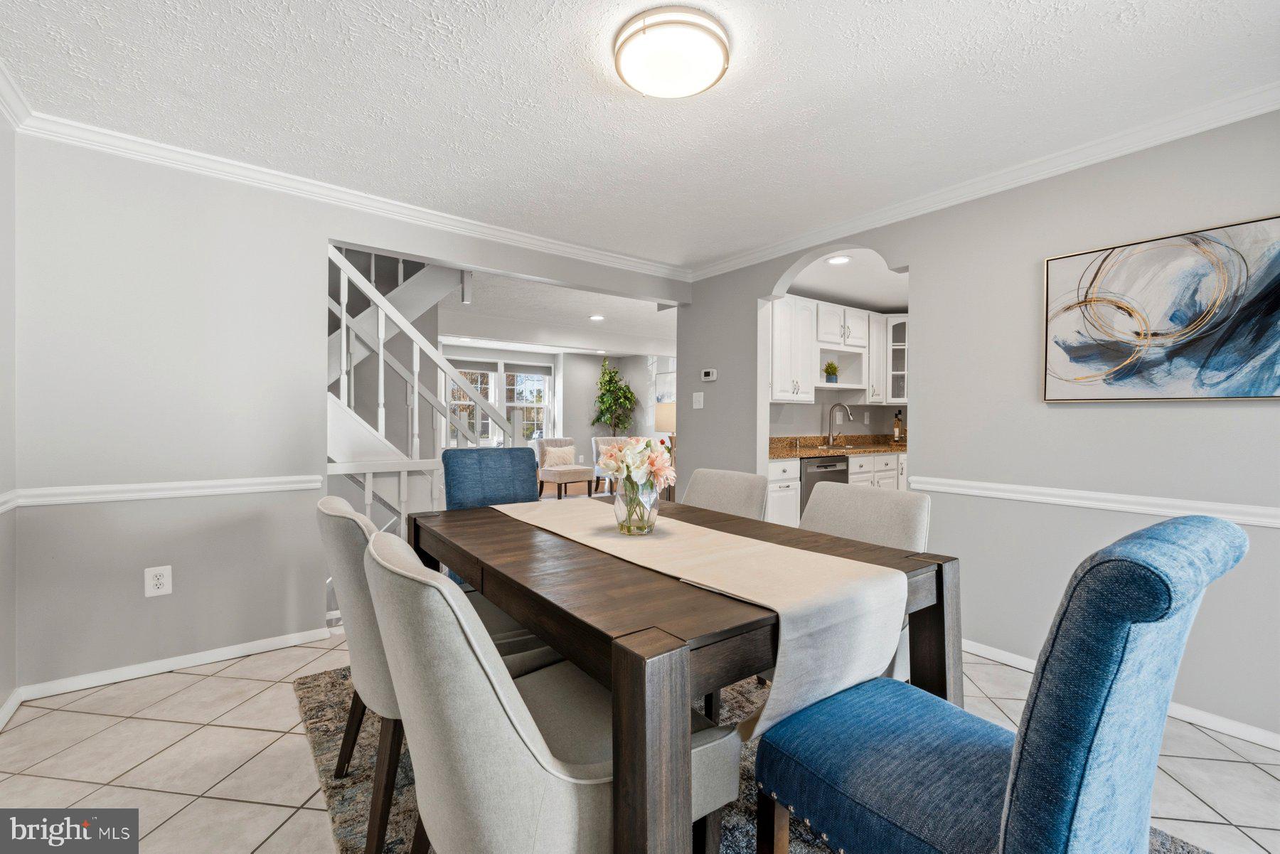 5 Pontiac Way Gaithersburg, MD 20878 - Photo 10 of 40 a view of a dining room with furniture and a potted plant