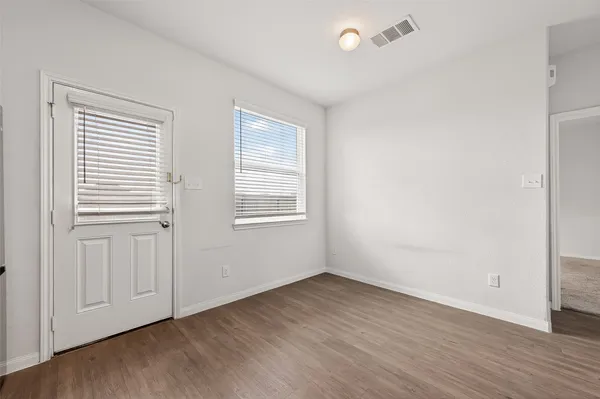 a view of an empty room and window
