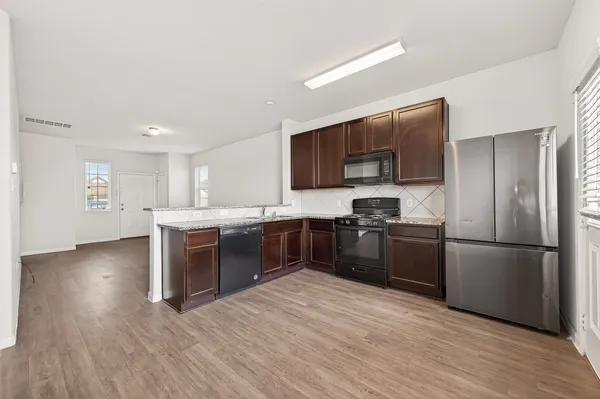 a kitchen with granite countertop a sink and a granite top