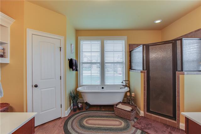 8003 Spirit Court Spring Hill, TN 37174 - Photo 11 of 18 Beautiful master bath, his and hers closets, sinks tile shower and claw foot tub