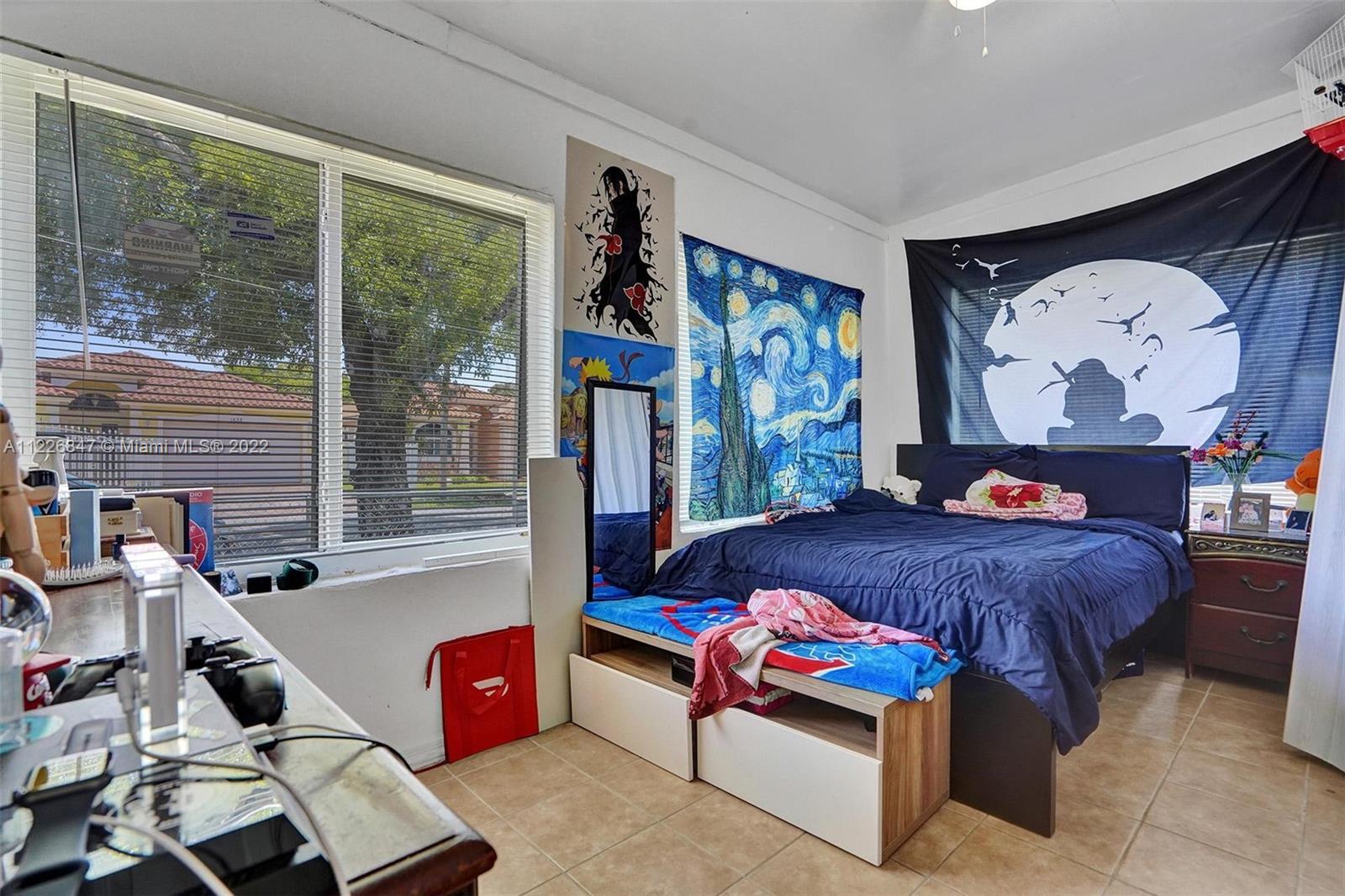 1554 Northwest 58th Street Miami, FL 33142 - Photo 15 of 57 a living room with furniture and a window