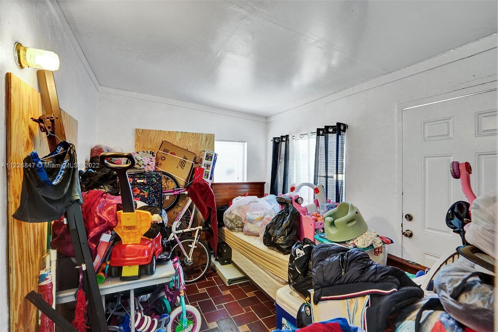 1554 Northwest 58th Street Miami, FL 33142 - Photo 17 of 57 Front - Entrance Florida room being used currently as a bedroom