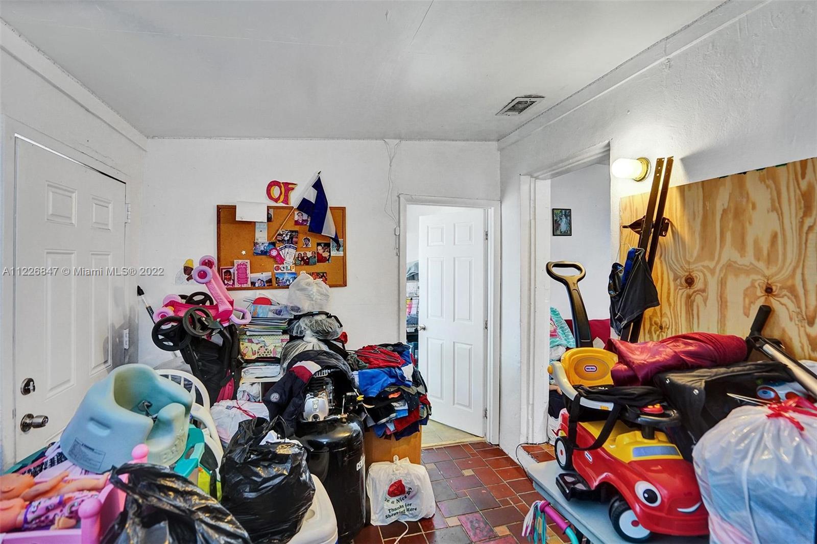 1554 Northwest 58th Street Miami, FL 33142 - Photo 18 of 57 Front - Entrance Florida room haas access to bedroom #3