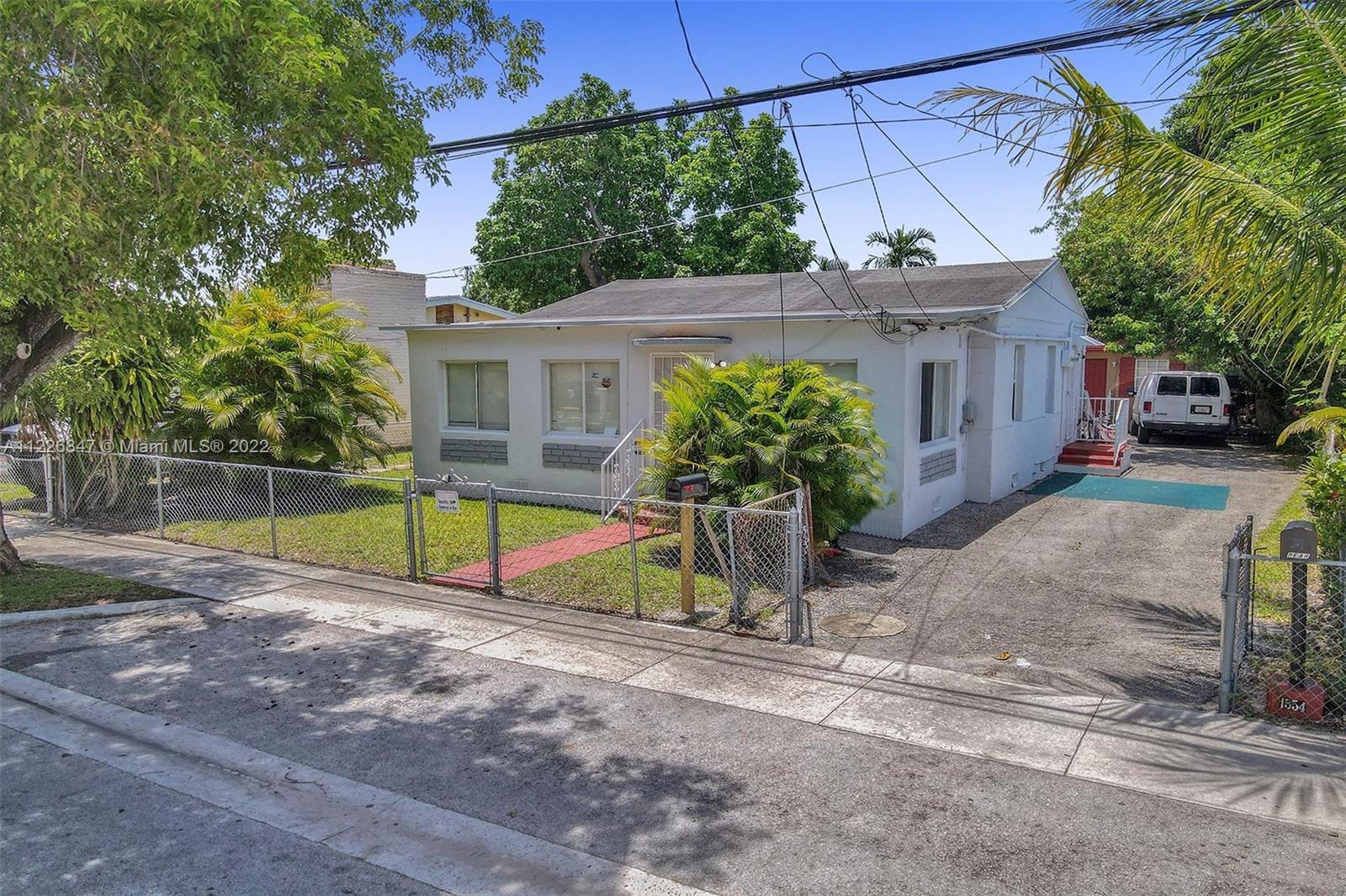 1554 Northwest 58th Street Miami, FL 33142 - Photo 2 of 57 a view of a backyard with a small swimming pool