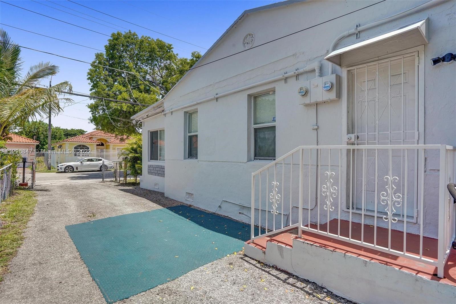 1554 Northwest 58th Street Miami, FL 33142 - Photo 39 of 57 a balcony with view of car parked