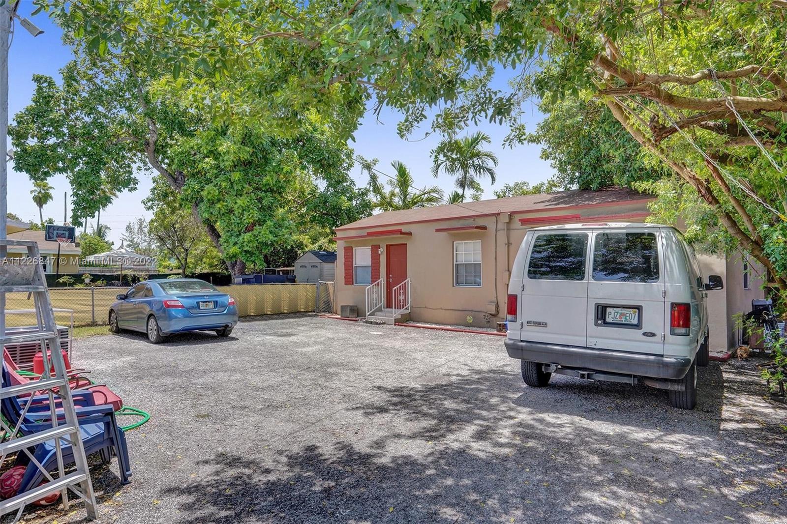1554 Northwest 58th Street Miami, FL 33142 - Photo 40 of 57 a view of a house with backyard tub and couches